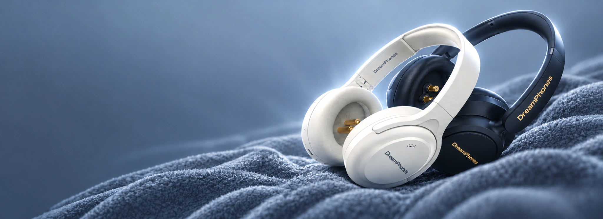 DreamPhones white and black relaxation headphones on a soft blue blanket