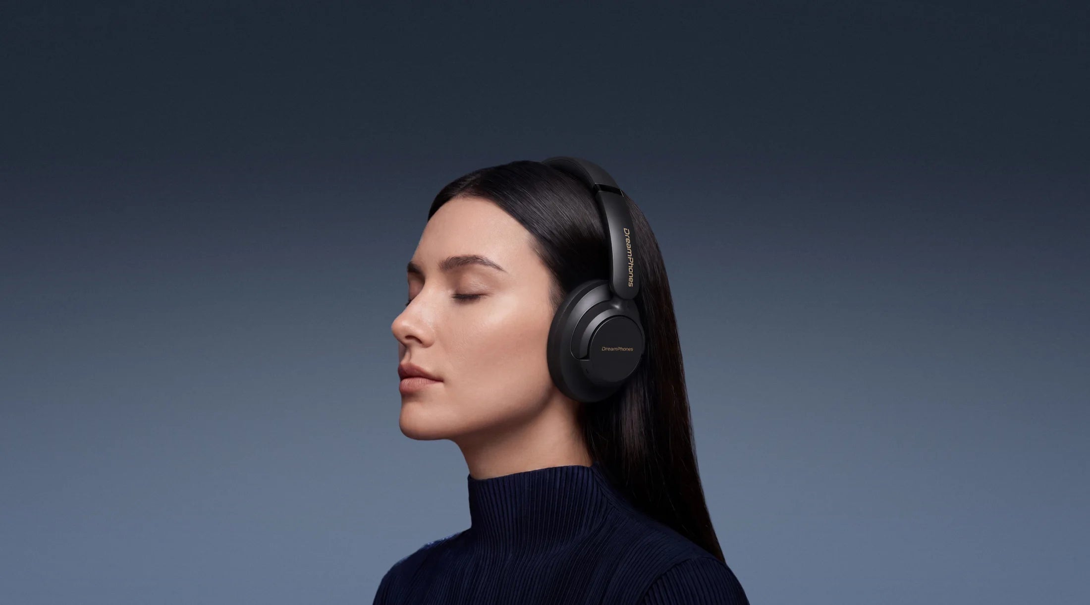 Woman wearing Obsidian Black DreamPhones during a guided session